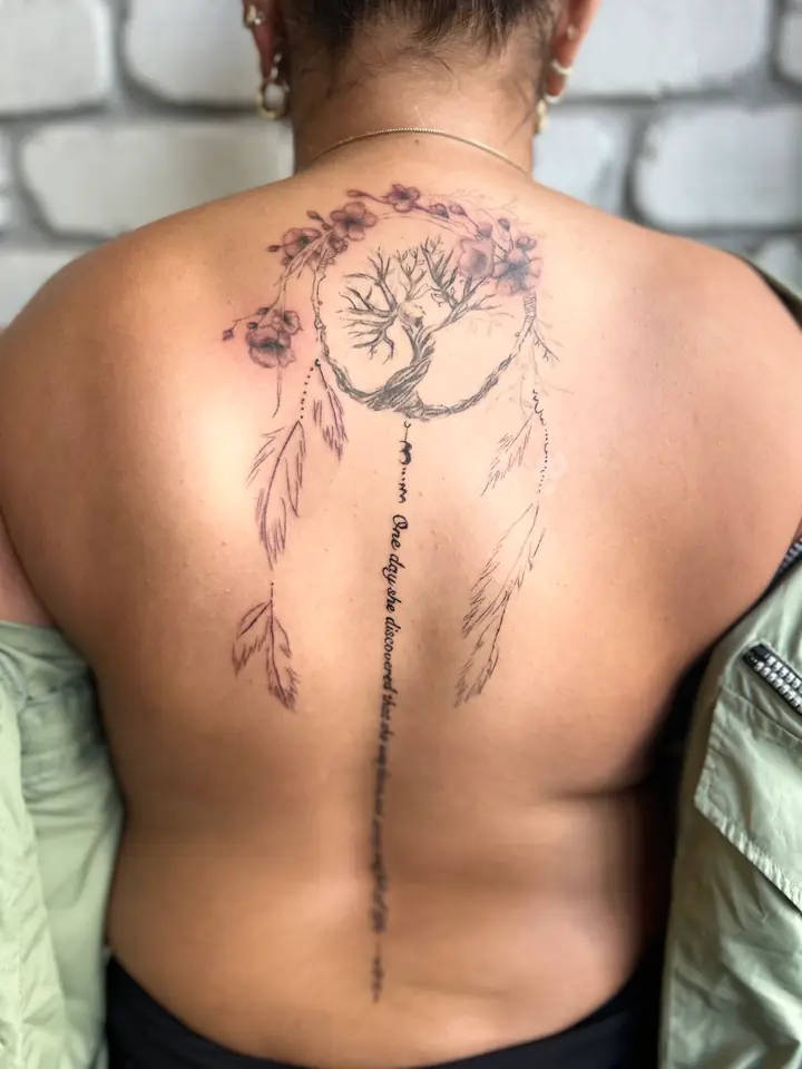 Tree of life, moon and feathers back piece along the spine